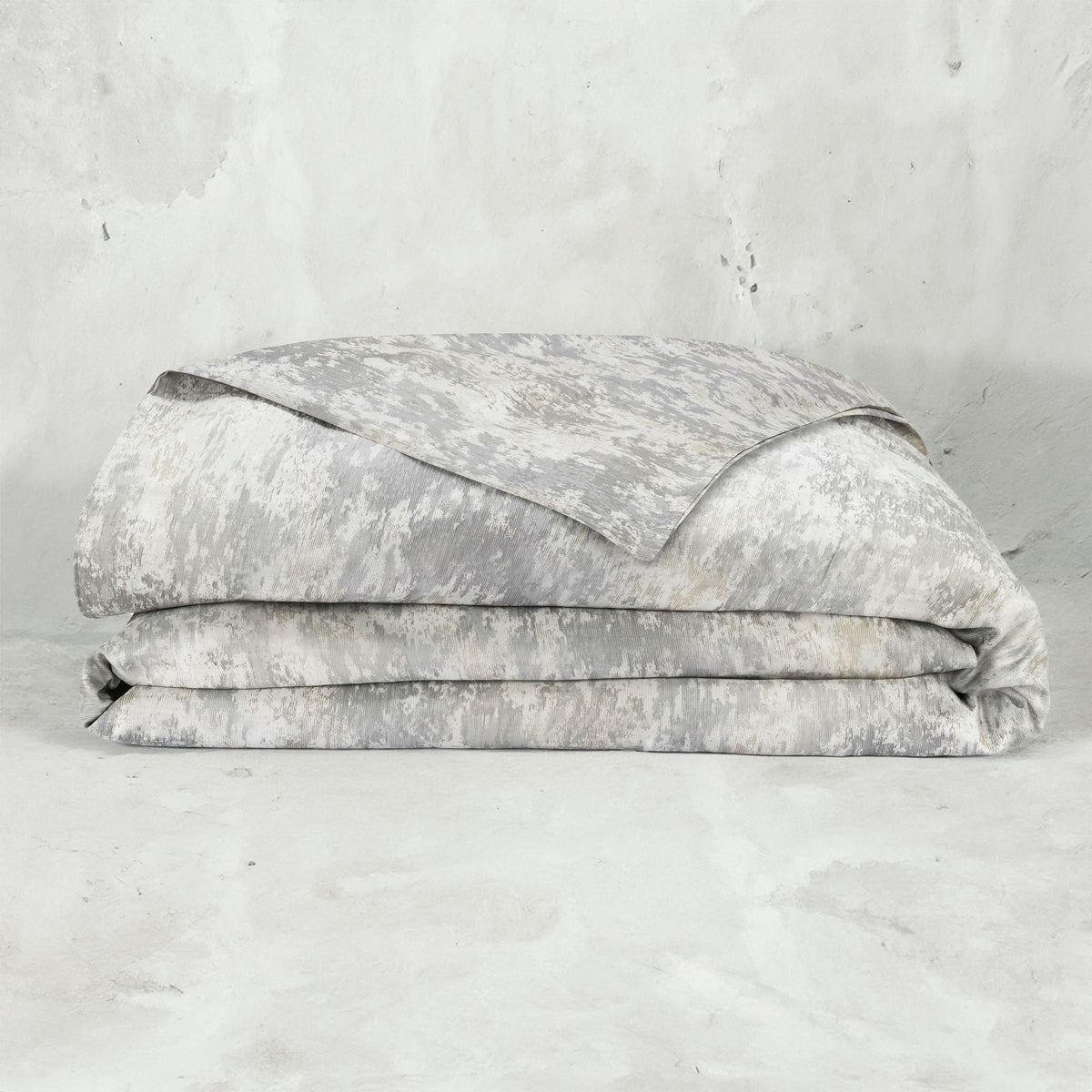 A folded LETTO Le Marais Jacquard Duvet cover in color Heather. data-image-id=