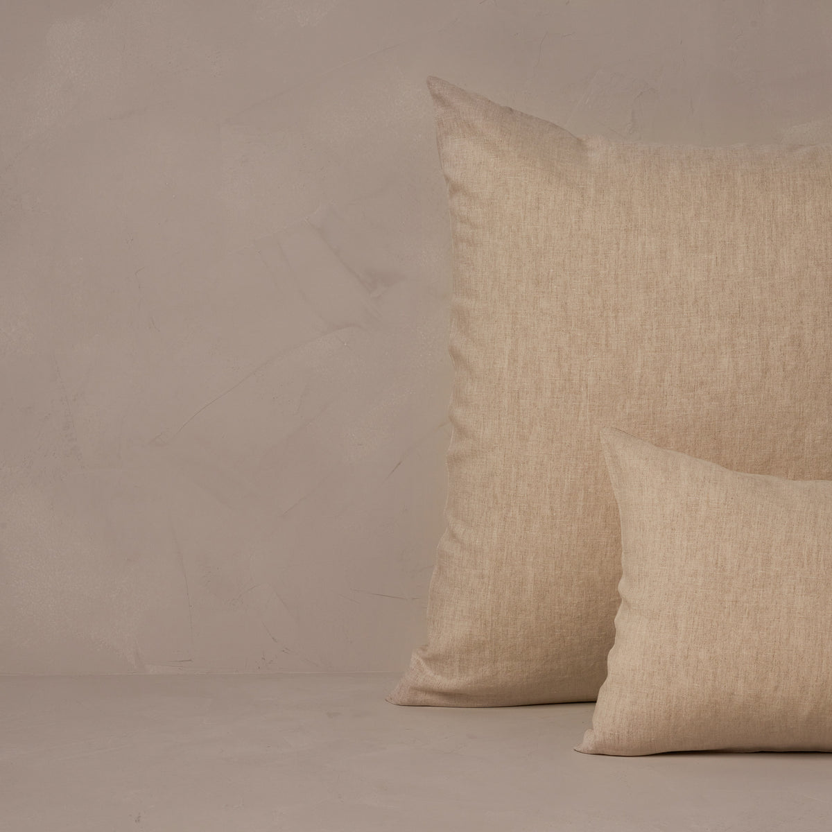 An image of a small boudoir or travel size pillow stacked in front of a large euro size pillow. The pillow cases are made in Italy of breathable and relaxed 100% linen, LETTO Classic Linen in color natural. data-image-id=