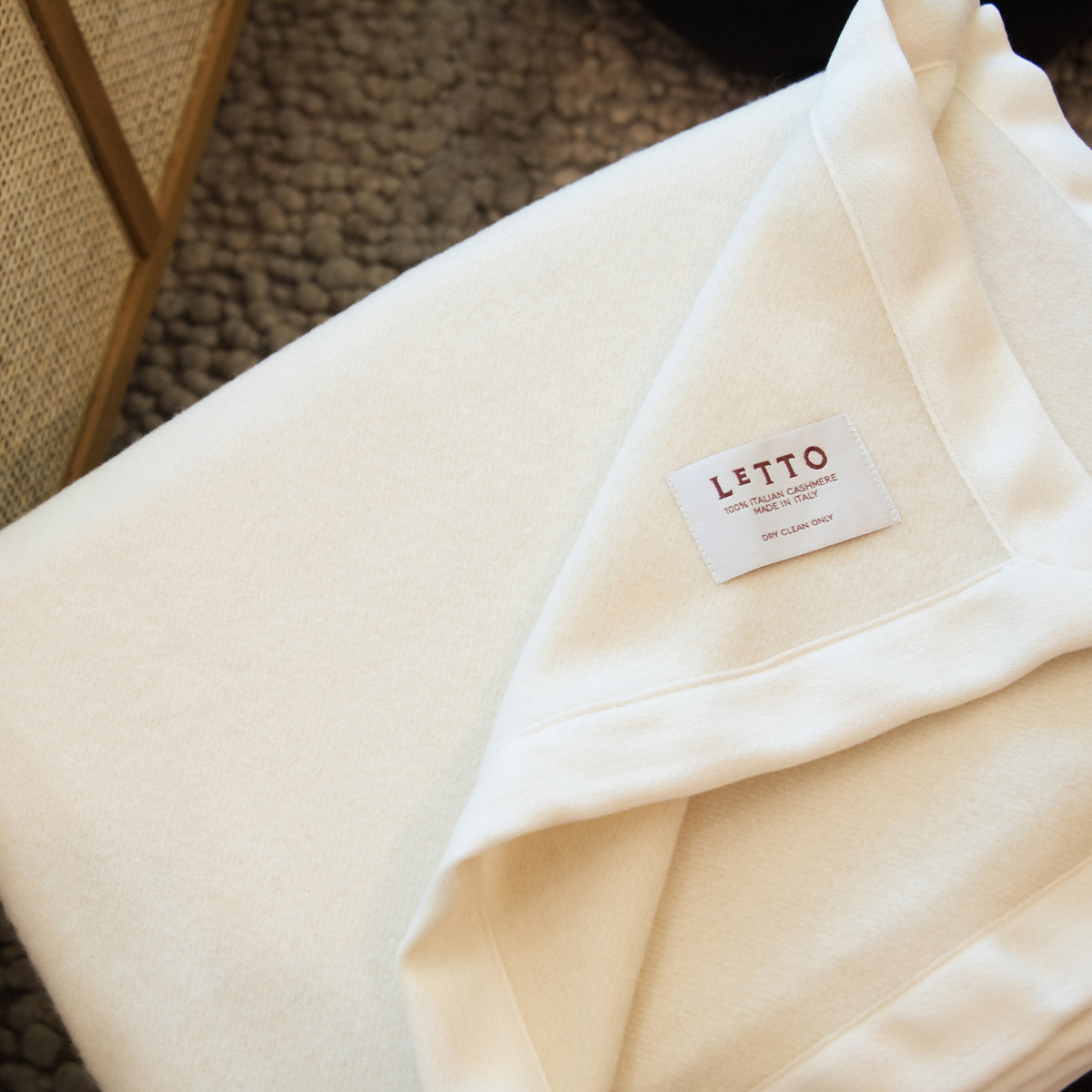 Image of the LETTO Alpina 100% cashmere blanket in color cream. data-image-id=