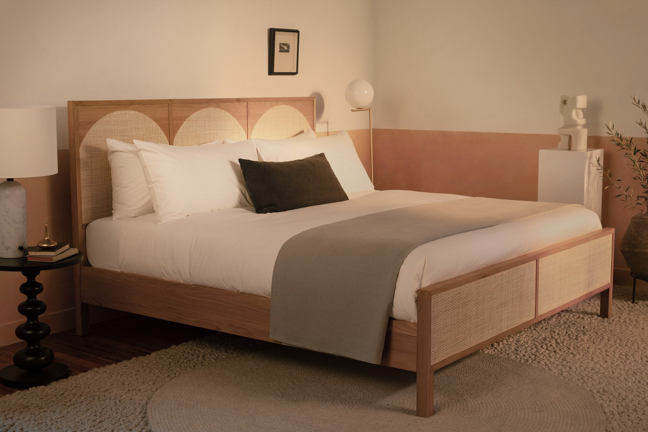 A contemporary bed made with white Americano cotton percale sheets and duvet cover. The sheets are made in Italy of American cotton. Bed shows a decorative gray throw blanket and dark gray throw pillow.