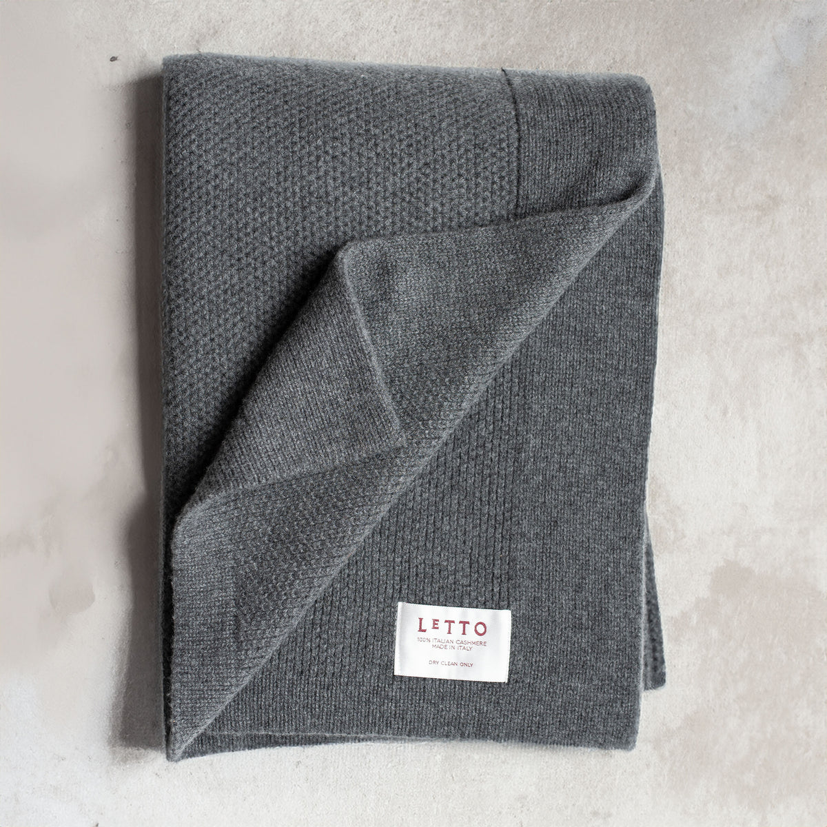 Image of the LETTO Domenica Knit Cashmere Throw in color Charcoal. data-image-id=
