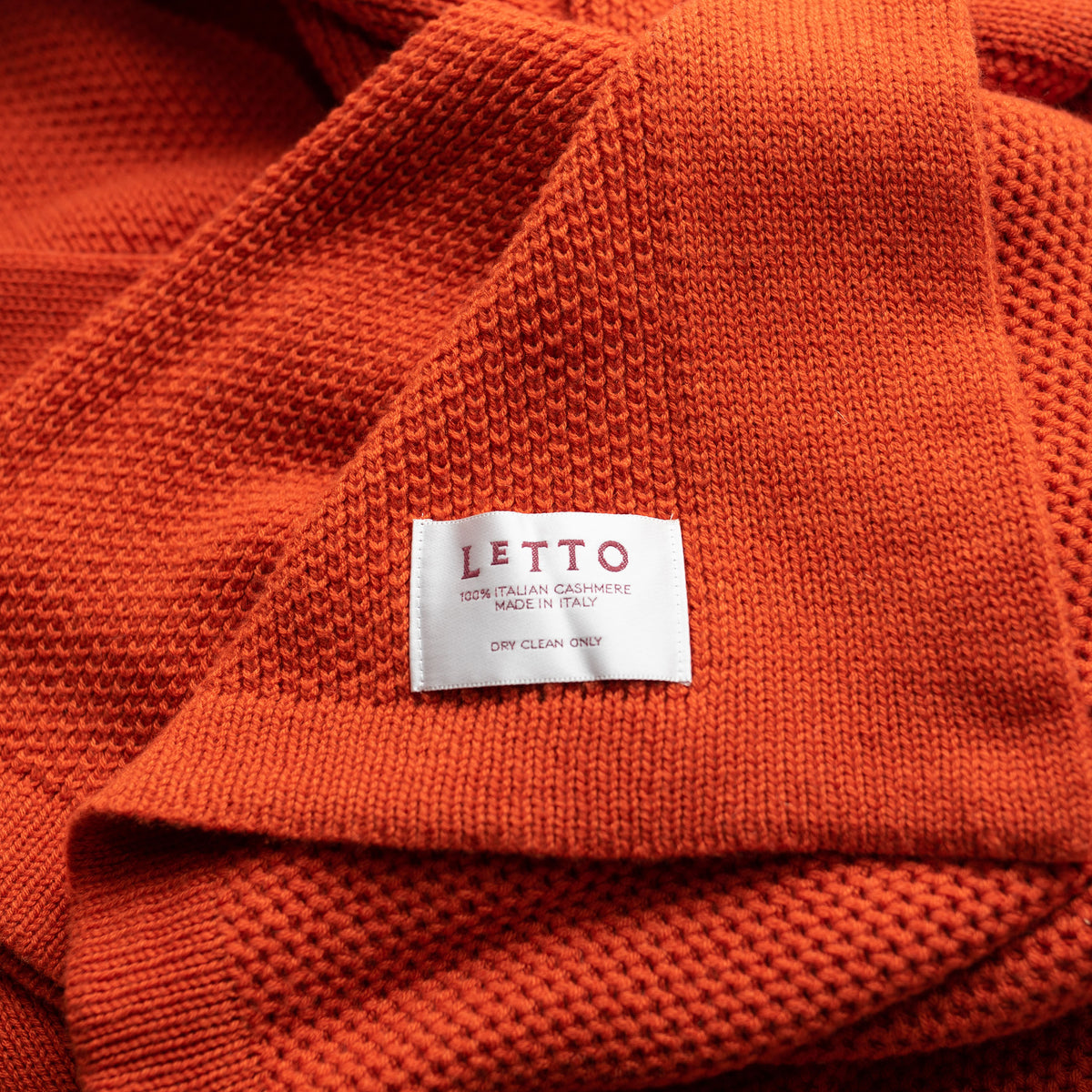 Image of the LETTO Domenica Knit Cashmere Throw in color Orange. data-image-id=