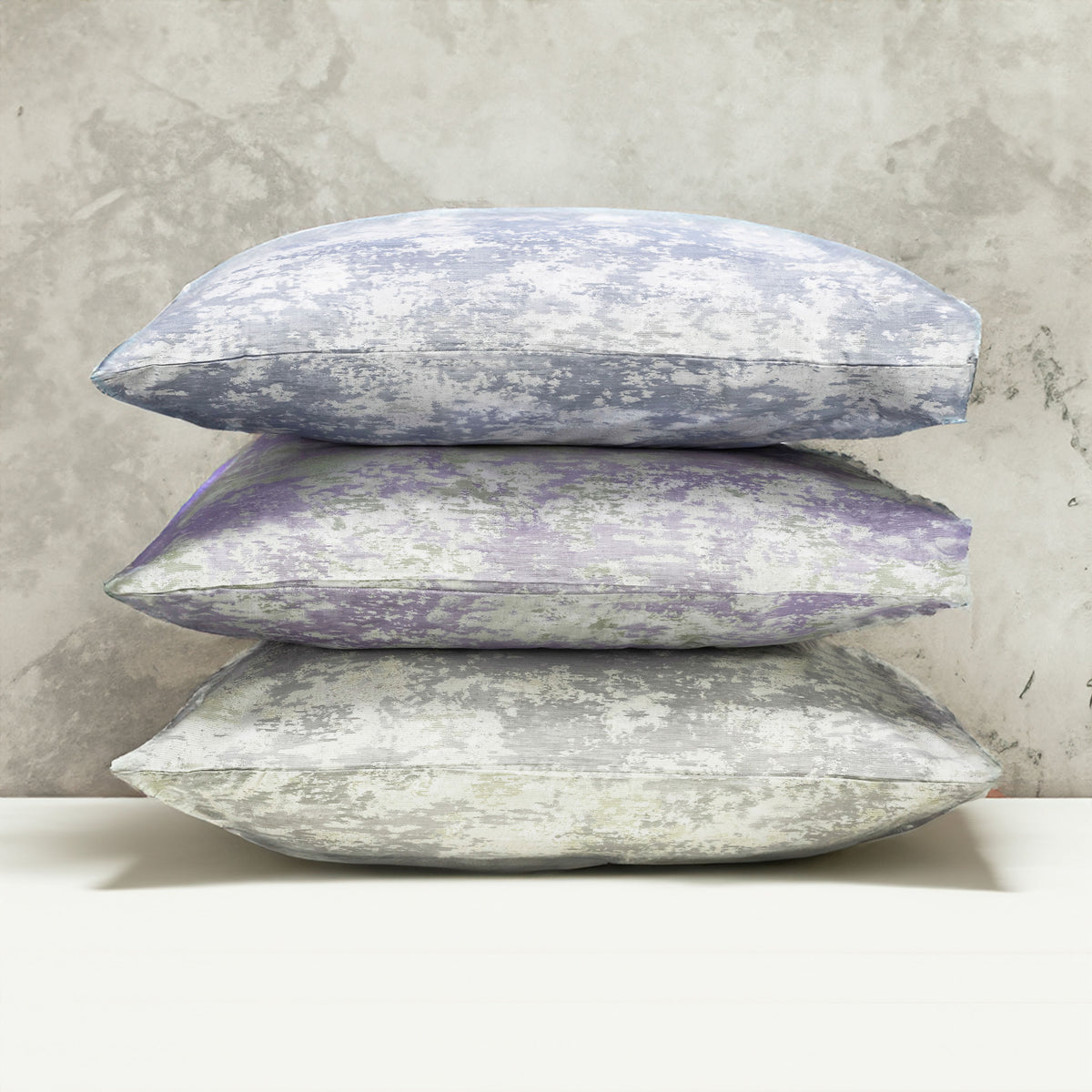 A stack of pillows in three colors of the with LETTO Le Marais Jacquard pattern. data-image-id=