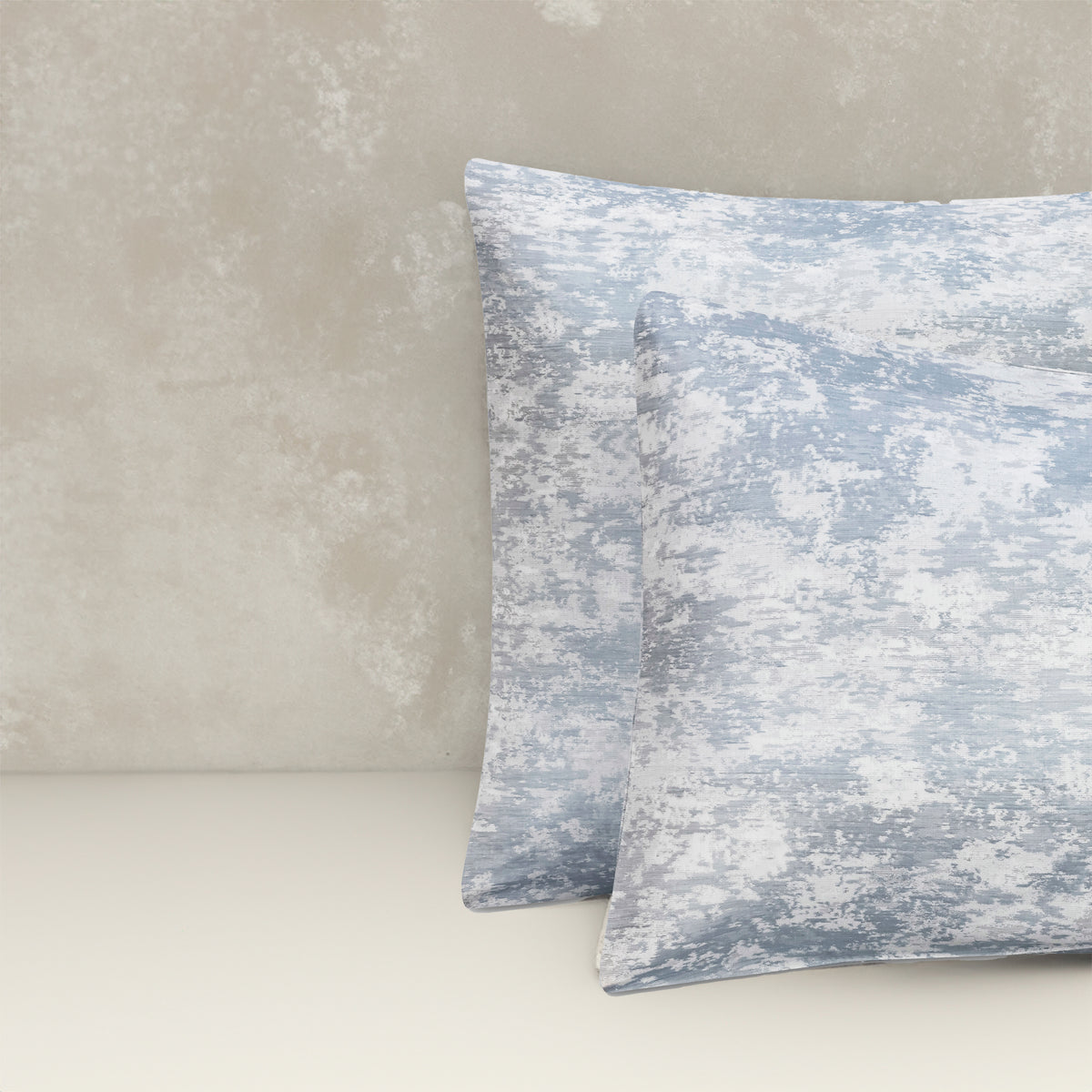 An image of two pillows stacked one in front of the other. The pillow cases are made of LETTO Le Marais Jacquard fabric in color Ocean. data-image-id=