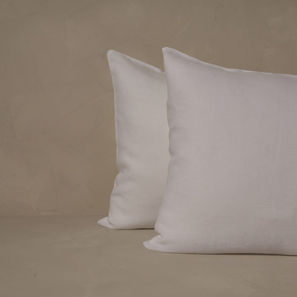 An image of two pillows stacked one in front of the other. The pillow cases are made of LETTO 100% linen Lino Primo in color white.
