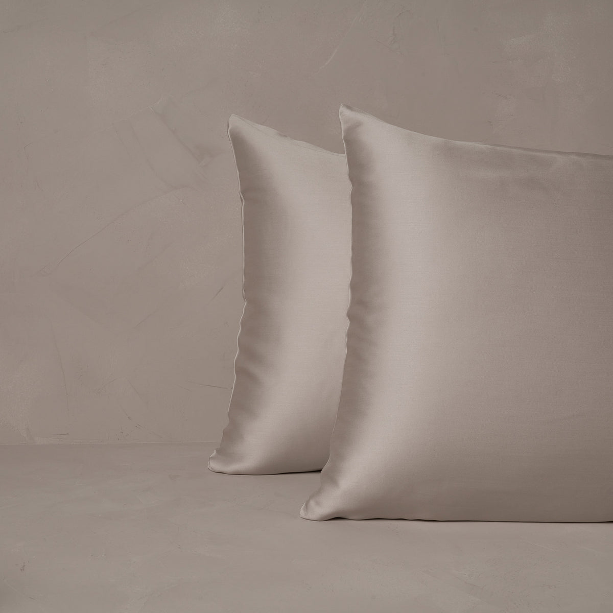 An image of two pillows stacked one in front of the other. The pillow cases are made of LETTO Woodland Silk beechwood modal in color gray. data-image-id=